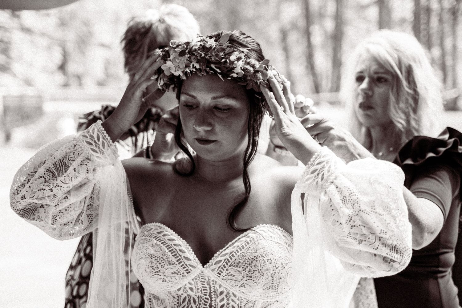 A series of black and white photographs showing close-up details of vintage lace wedding dresses and bridal accessories.