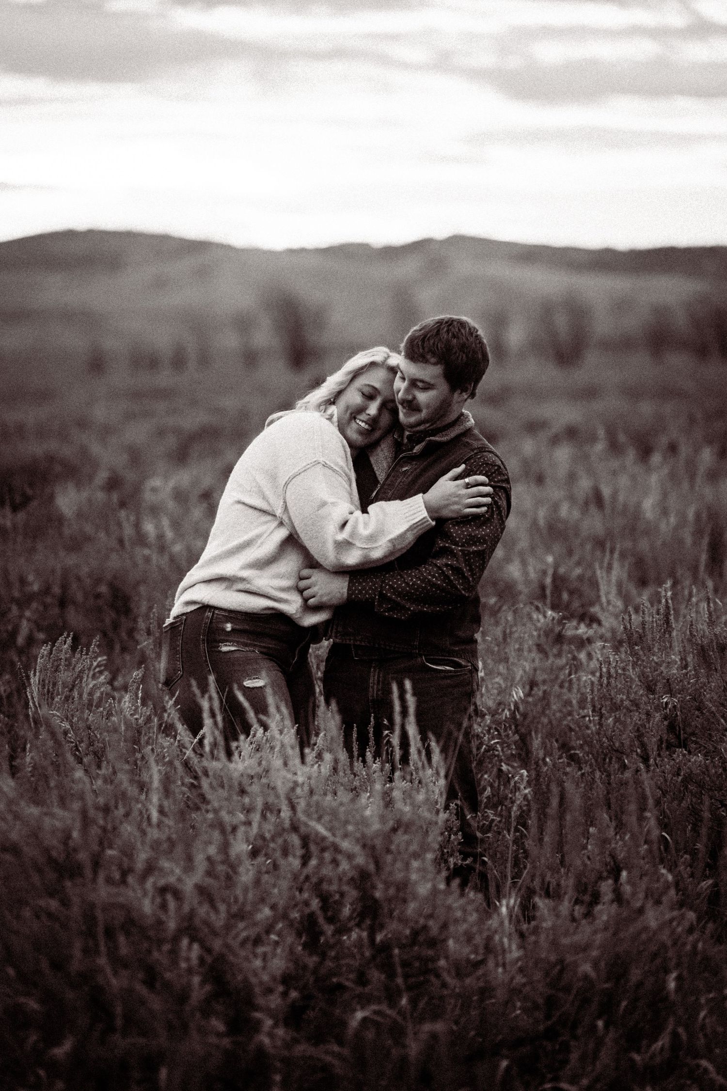 A romantic black and white sequence showing a couple embracing in a field of wildflowers.