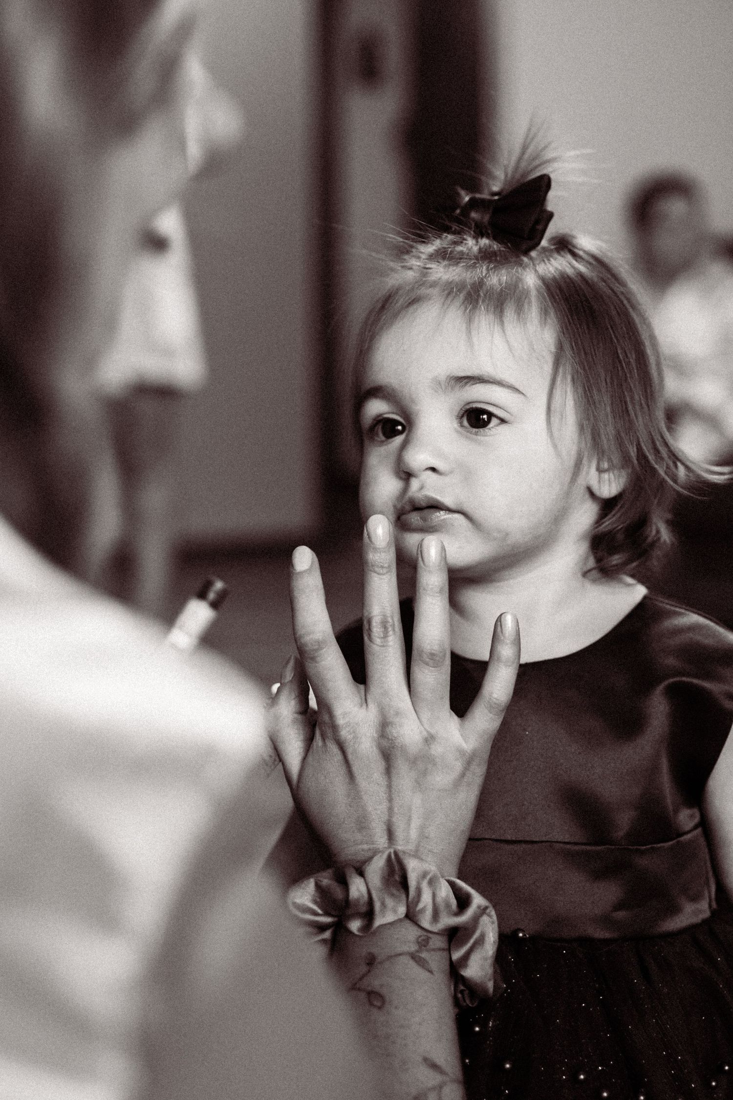 Black and white portrait series showing expressive child gestures and emotions.