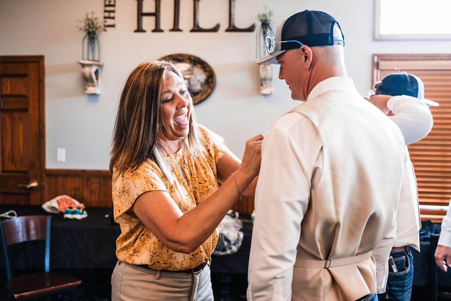 Casual wedding celebration moments captured at The Hill venue.