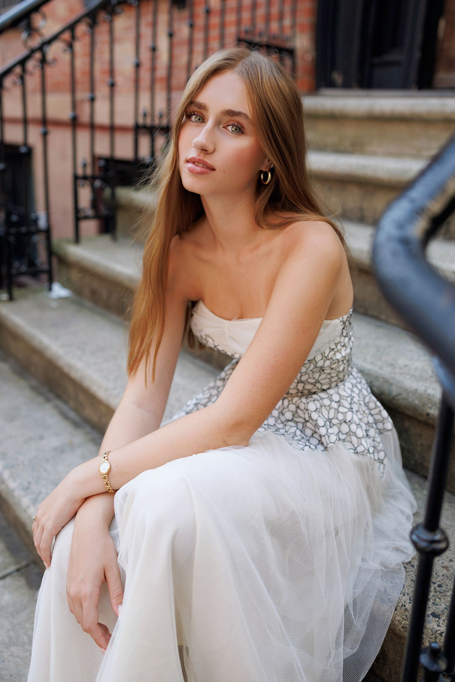 High School senior posing on a stoop in the West Village in New York City.