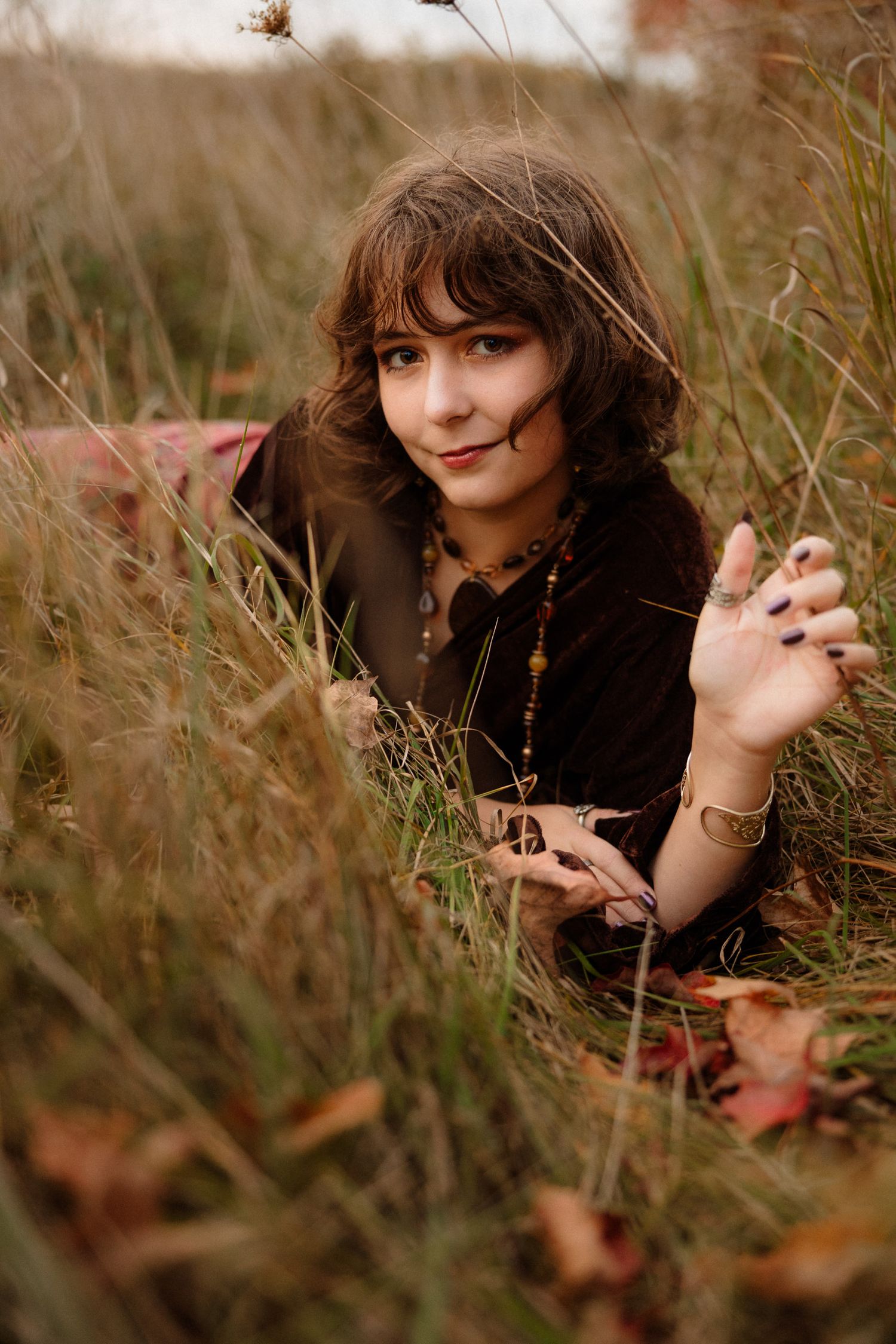 Senior portraits in golden hour field in Marquette, Michigan.