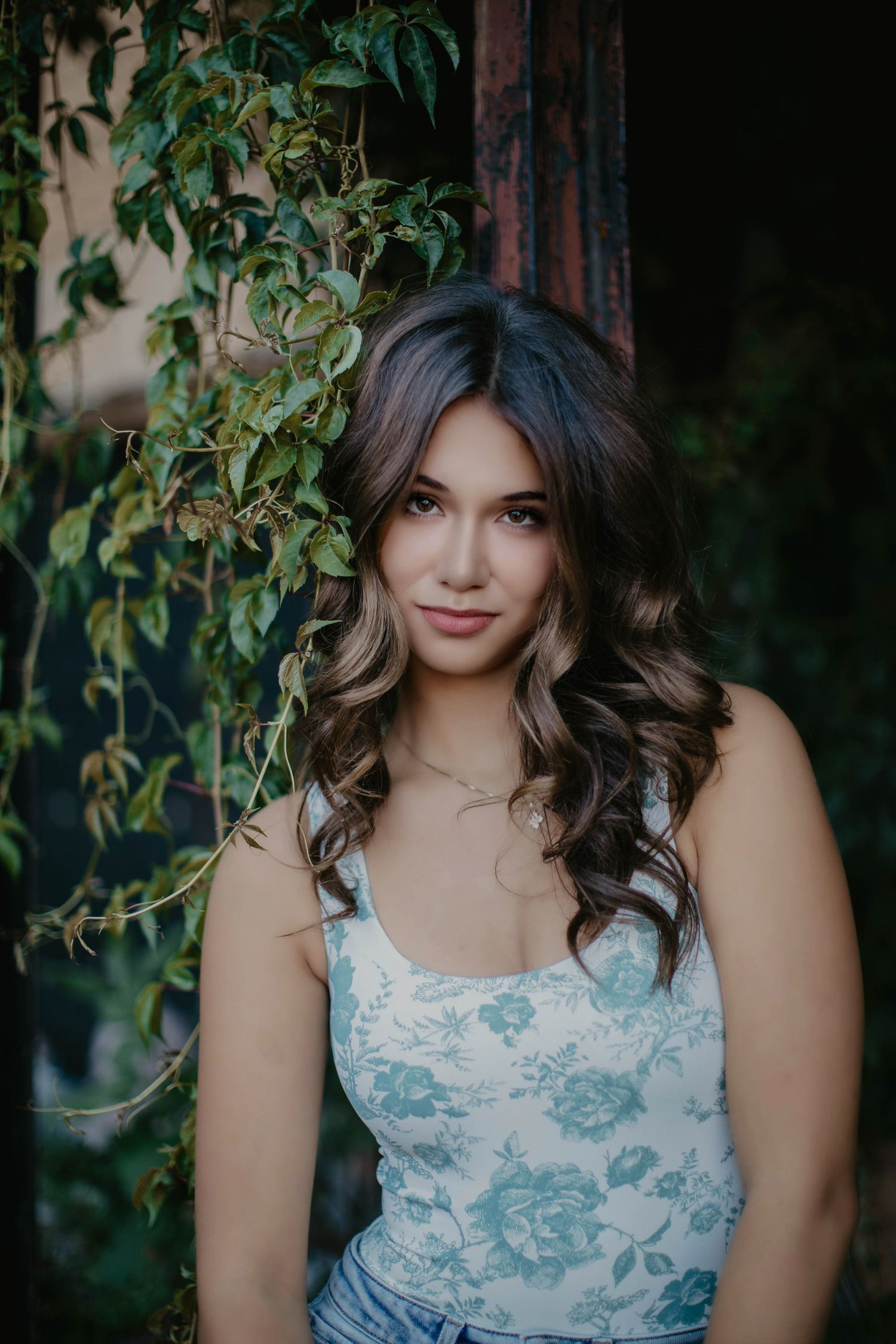 high school senior portraits girl standing by flowers, Marquette mi, Escanaba, NYC, Green Bay the best senior photographer