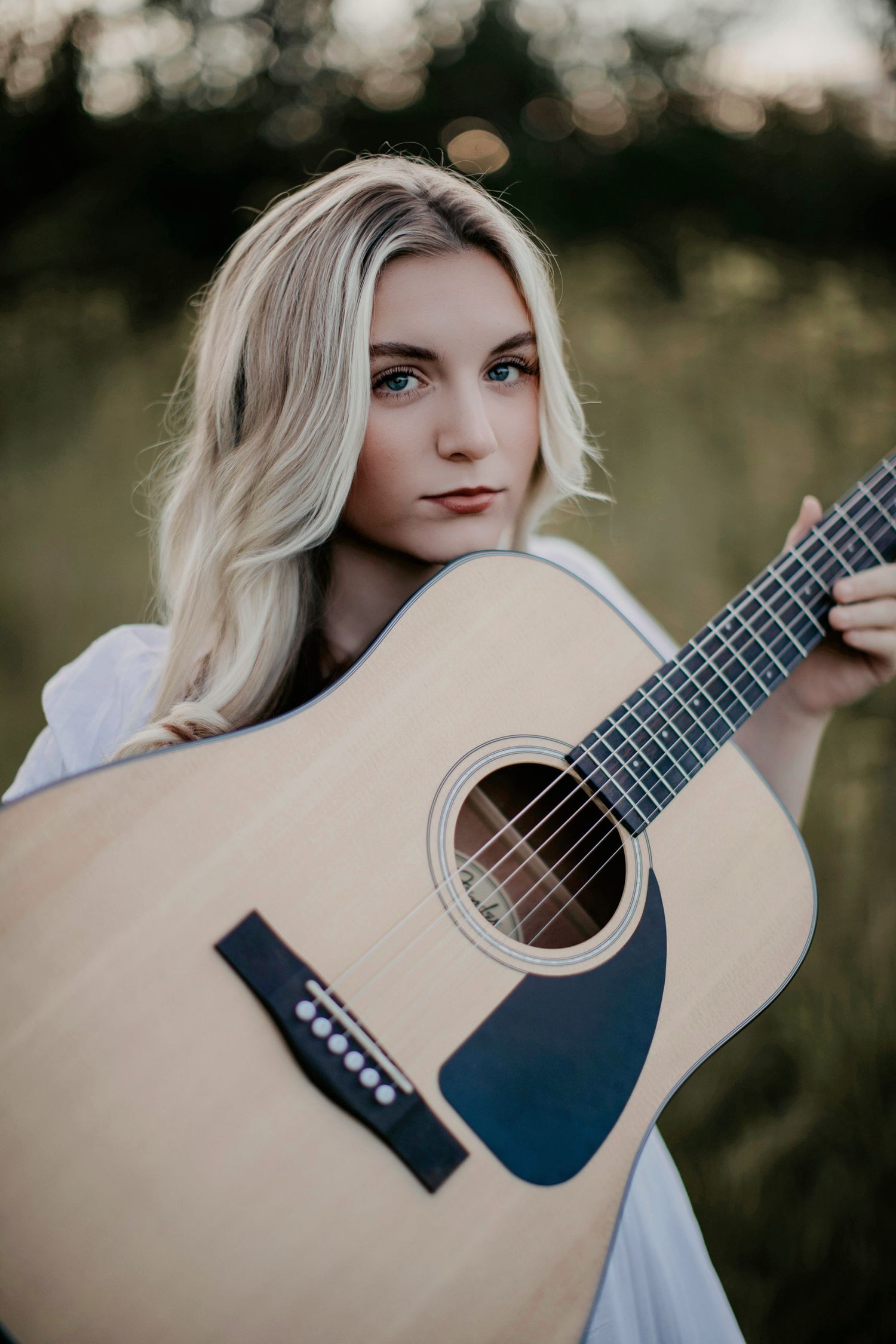 high school senior girl with guitar. Escanaba, Marquette, NYC best senior portrait photographer