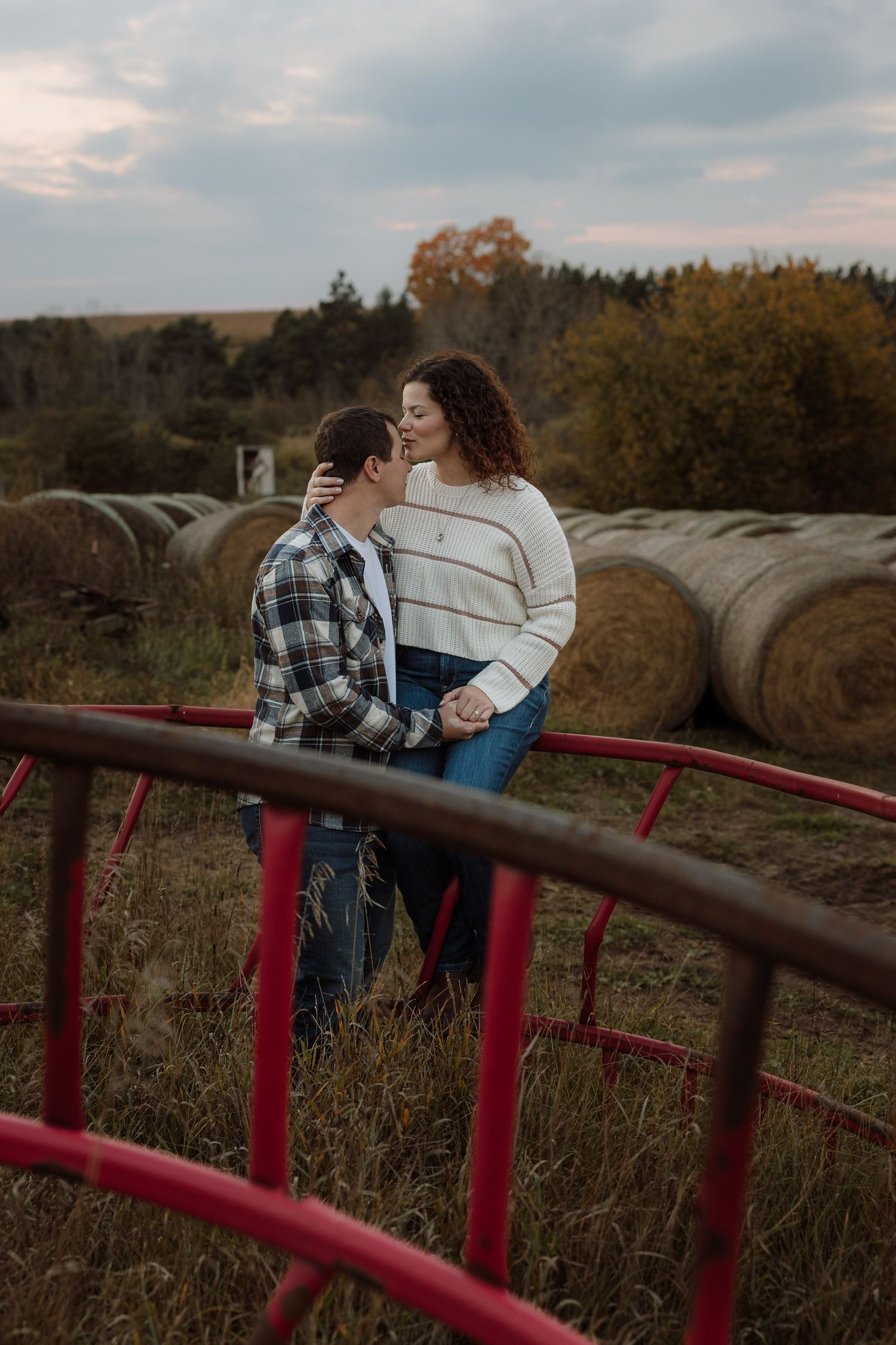 Intimate engagement shoot with hay bails in Escanaba, Michigan.