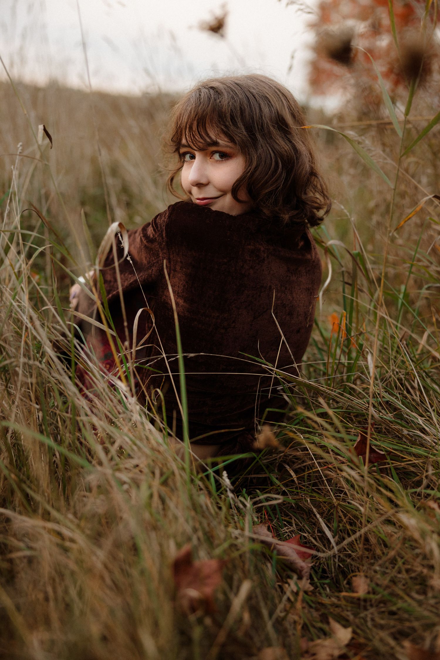 Senior portraits in golden hour field in Marquette, Michigan.