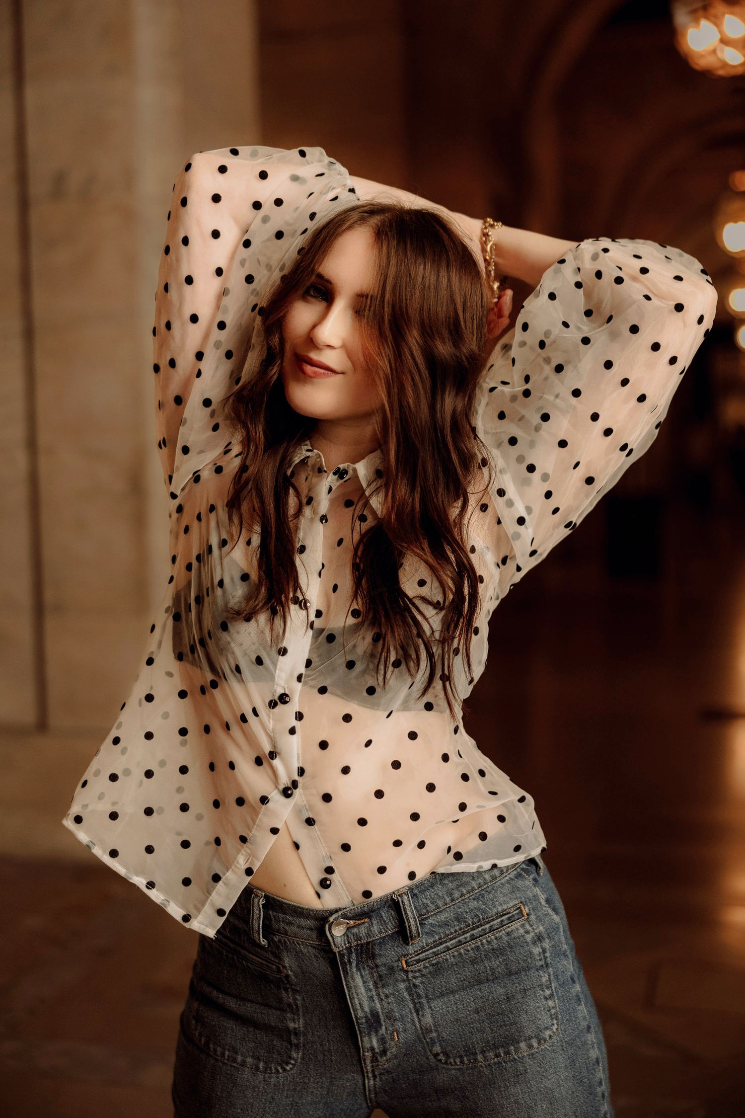 High school senior girl posing ideas for NYC public library polka dot shirt
