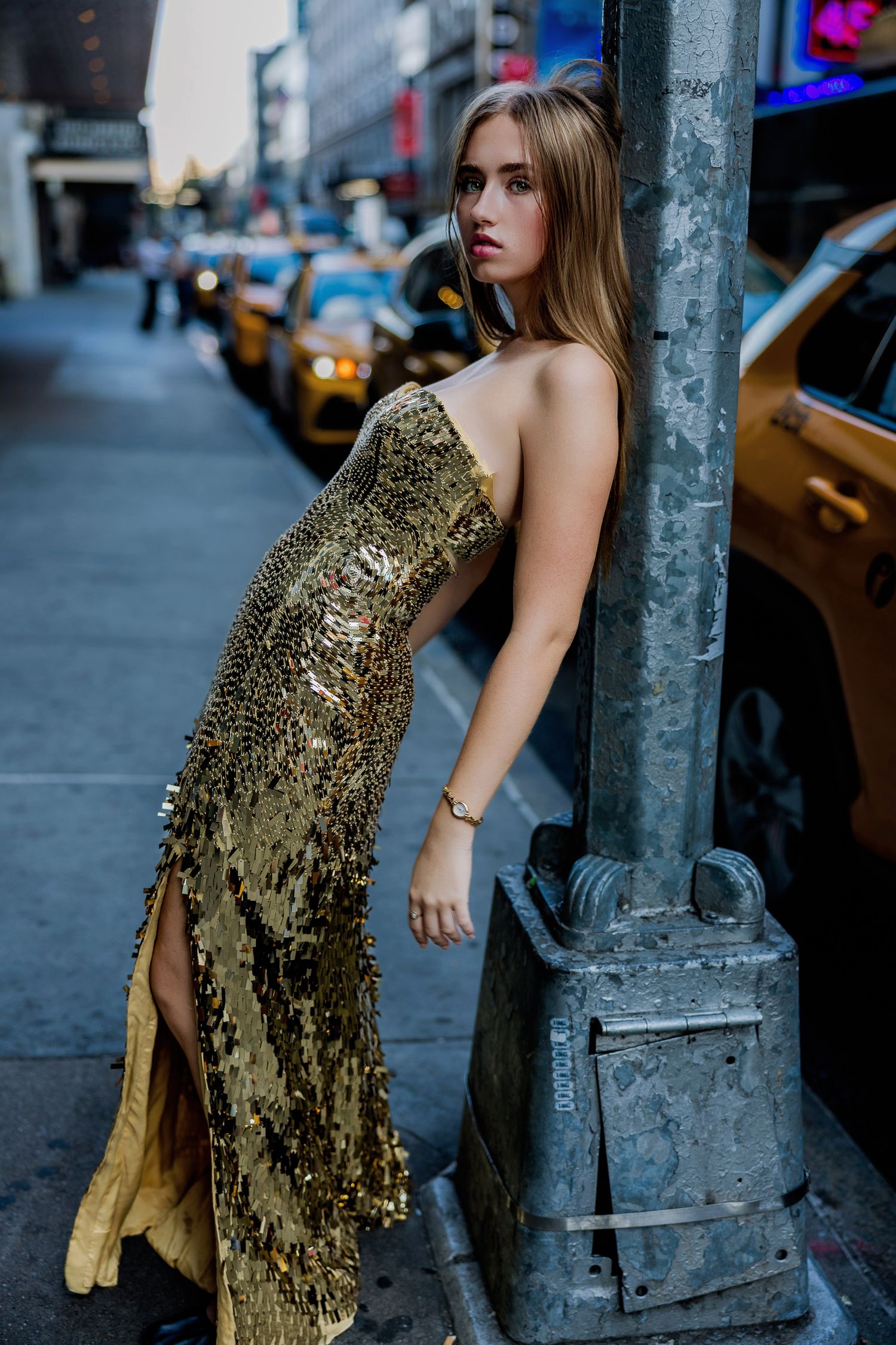 Beautiful girl poses for her Senior portraits in New York City in the theatre district.