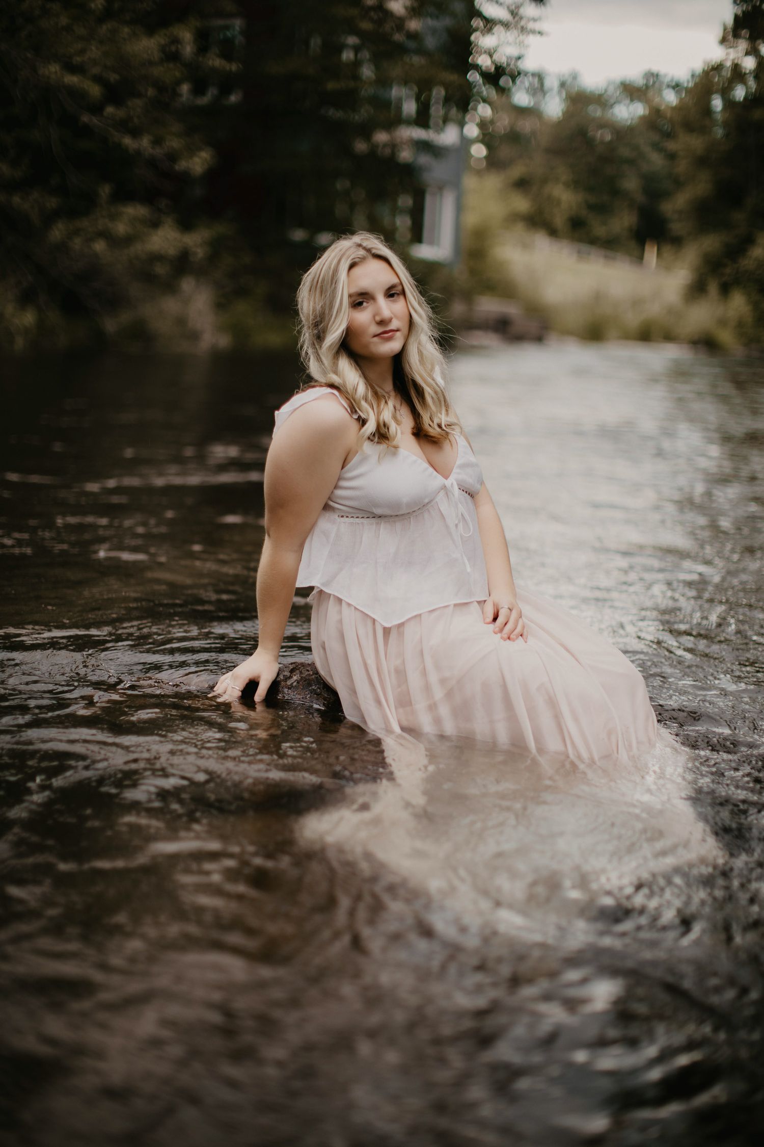 High school senior pictures a girl with flowing skirt in the water the best photographer in Marquette, Escanaba, NYC Upper peninsula of mi