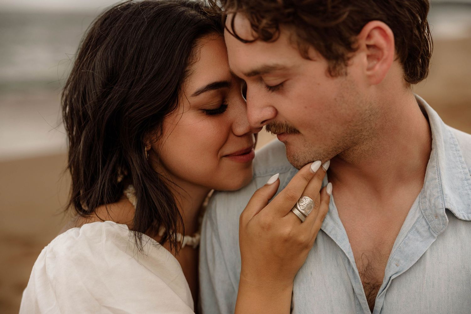 Beach engagement session of a couple at Tunnels beach in Kauai, Hawaii.