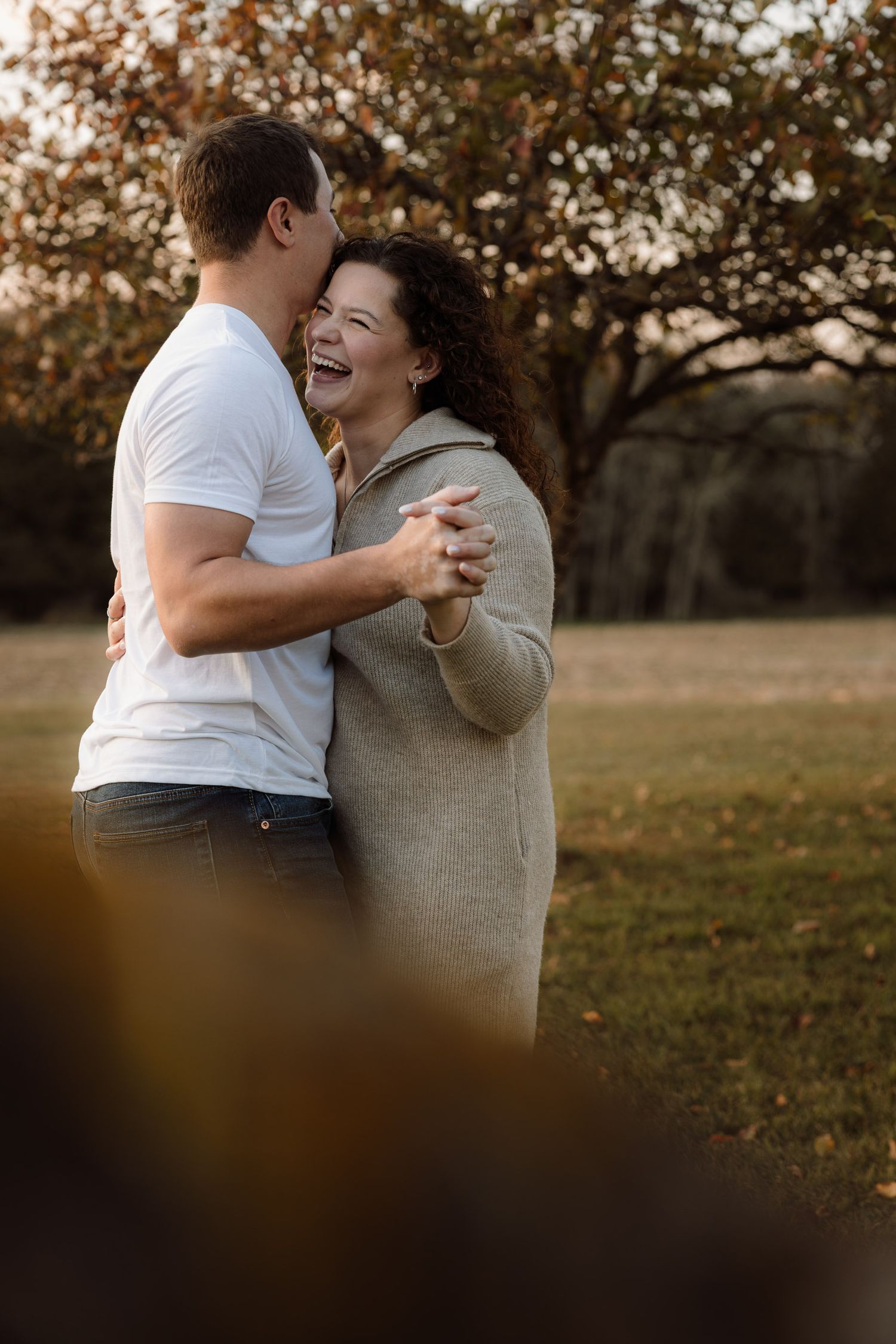 Engagement pictures in an apple orchard in Escanaba, Michigan