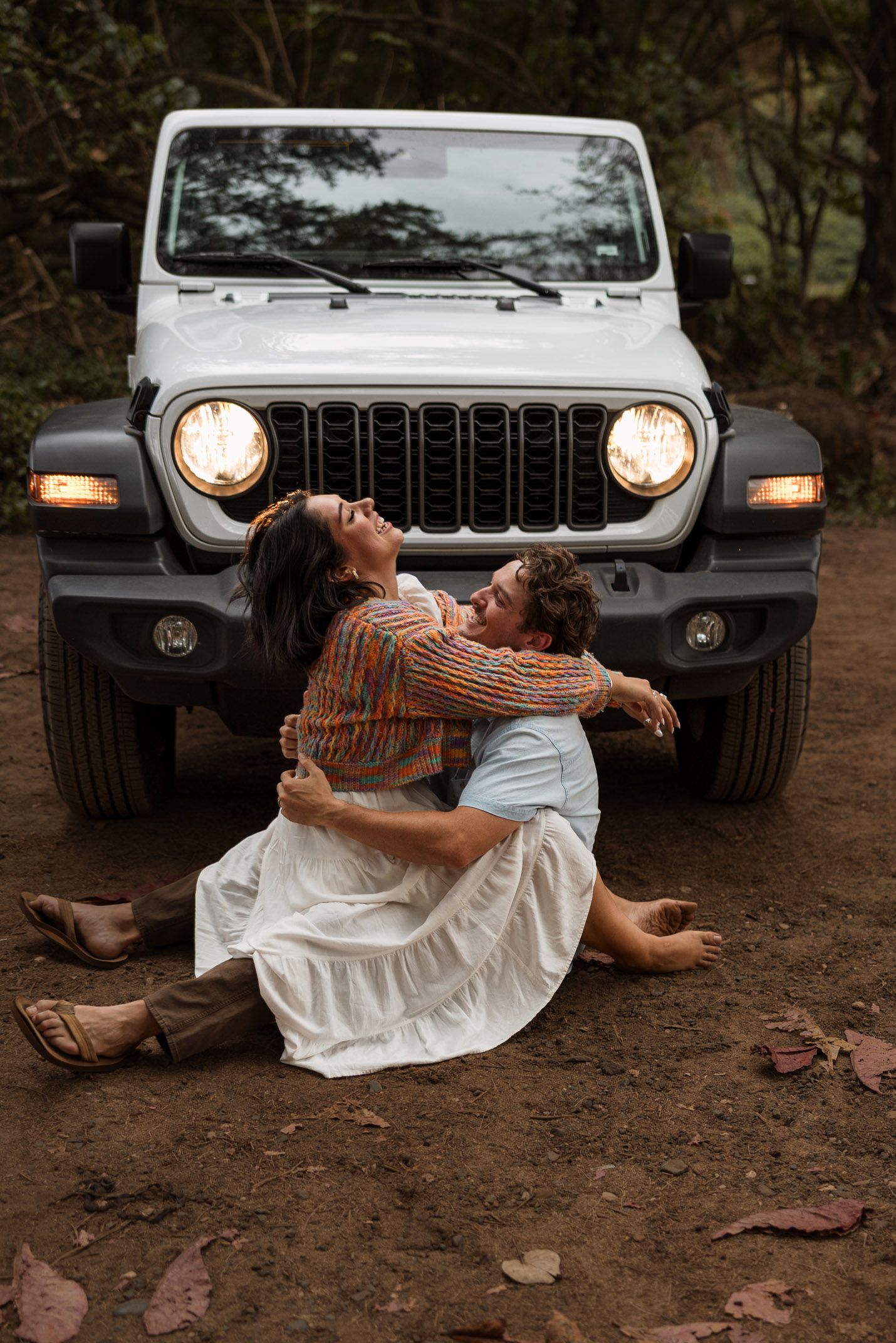 Engagement couple on the beach with a jeep in kauai, Hawaii. Elopement photographer, destination.