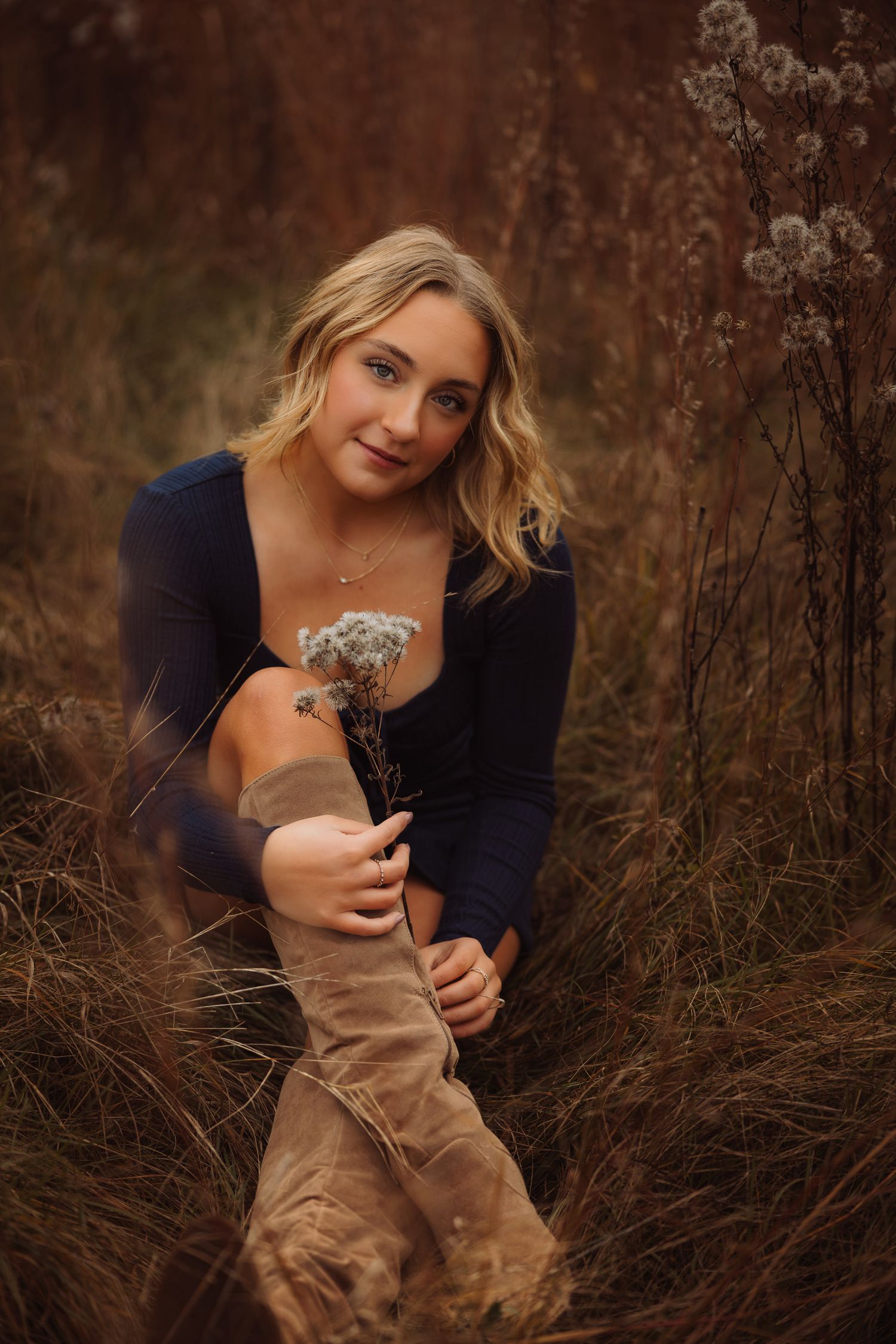 Senior portraits in golden hour field in Marquette, Michigan.