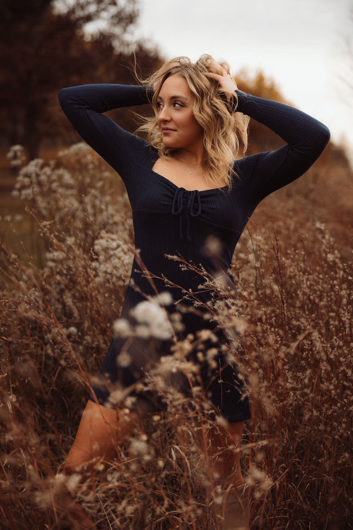 Senior portraits in golden hour field in Marquette, Michigan.