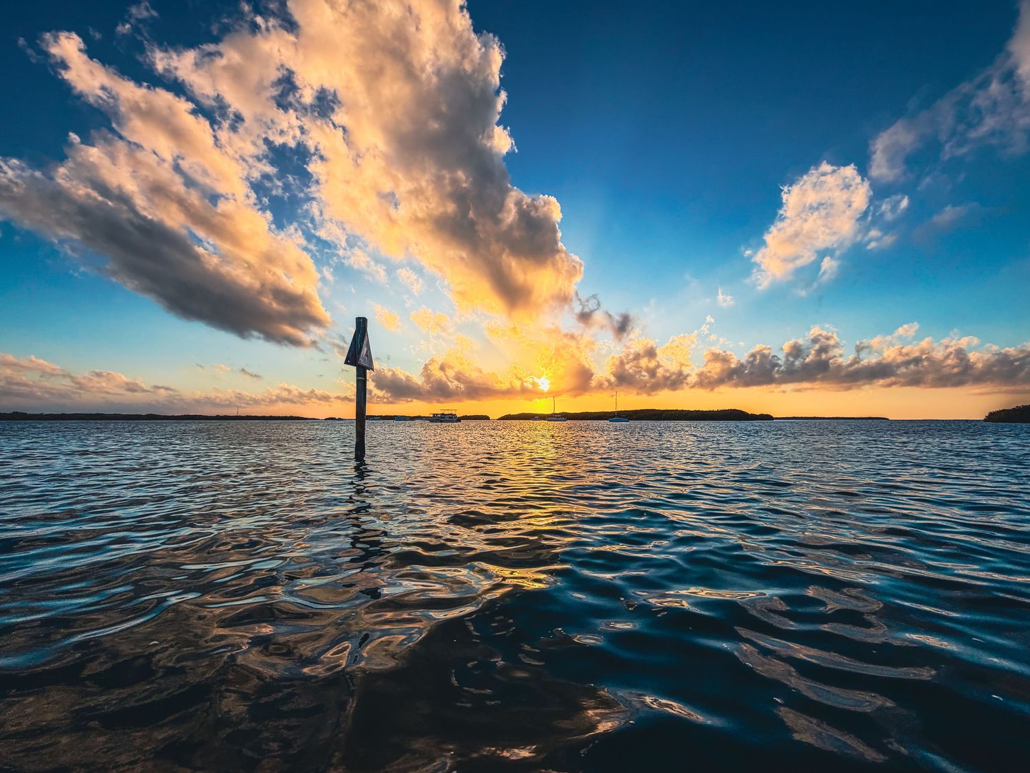 Golden sunset over the Florida Keys with calm ocean waters in Islamorada photographed in Islamorada by the Salty Shutter Photography