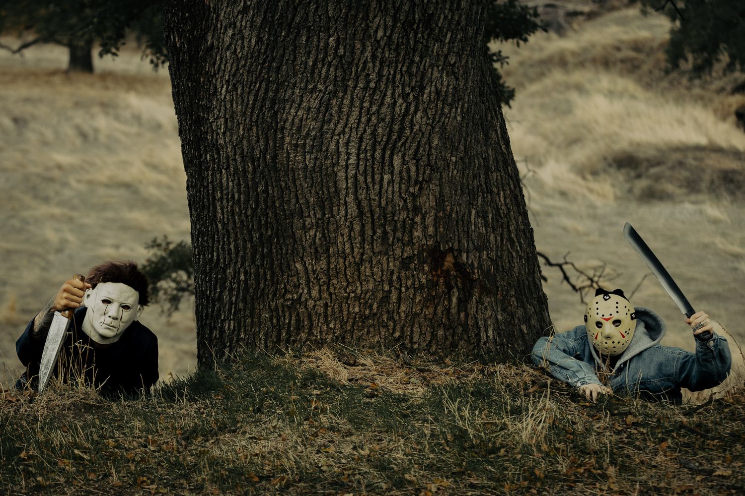 Artistic composition of figures among trees in shadowy woodland setting.