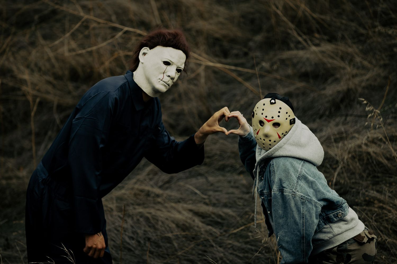 A series of dark moody engagement photos showing a couple posing romantically in a forest setting.