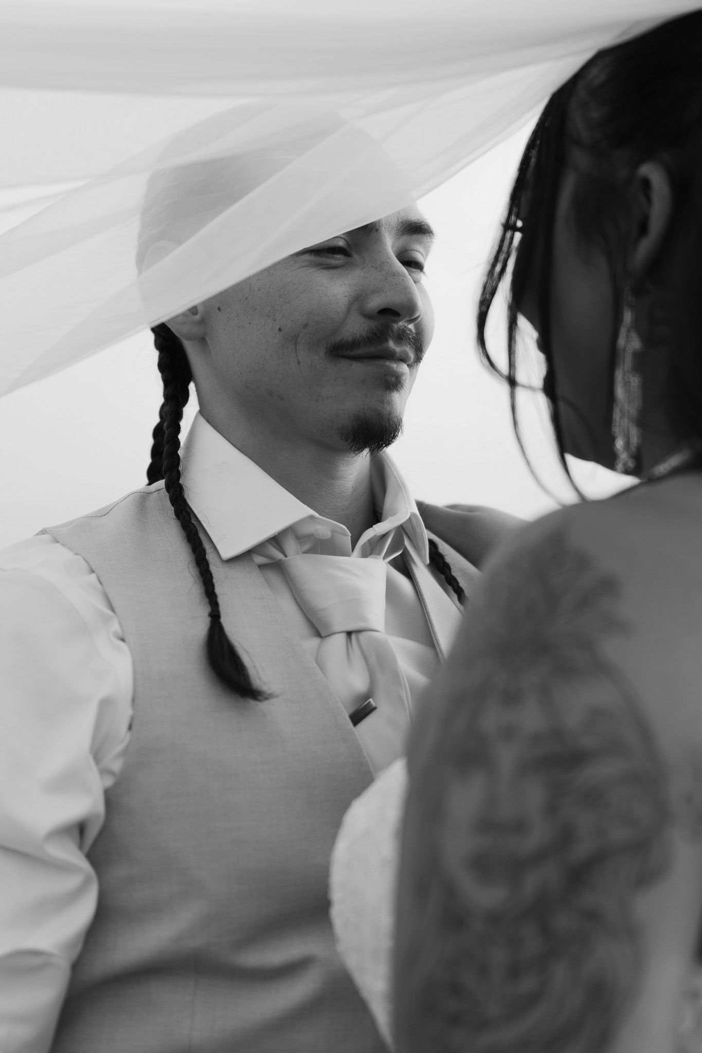 Intimate black and white wedding portrait sequence showing tender romantic moments between the newlyweds.
