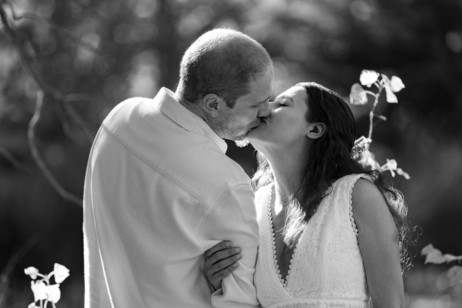 Black and white wedding photography sequence capturing intimate moments between newlyweds.