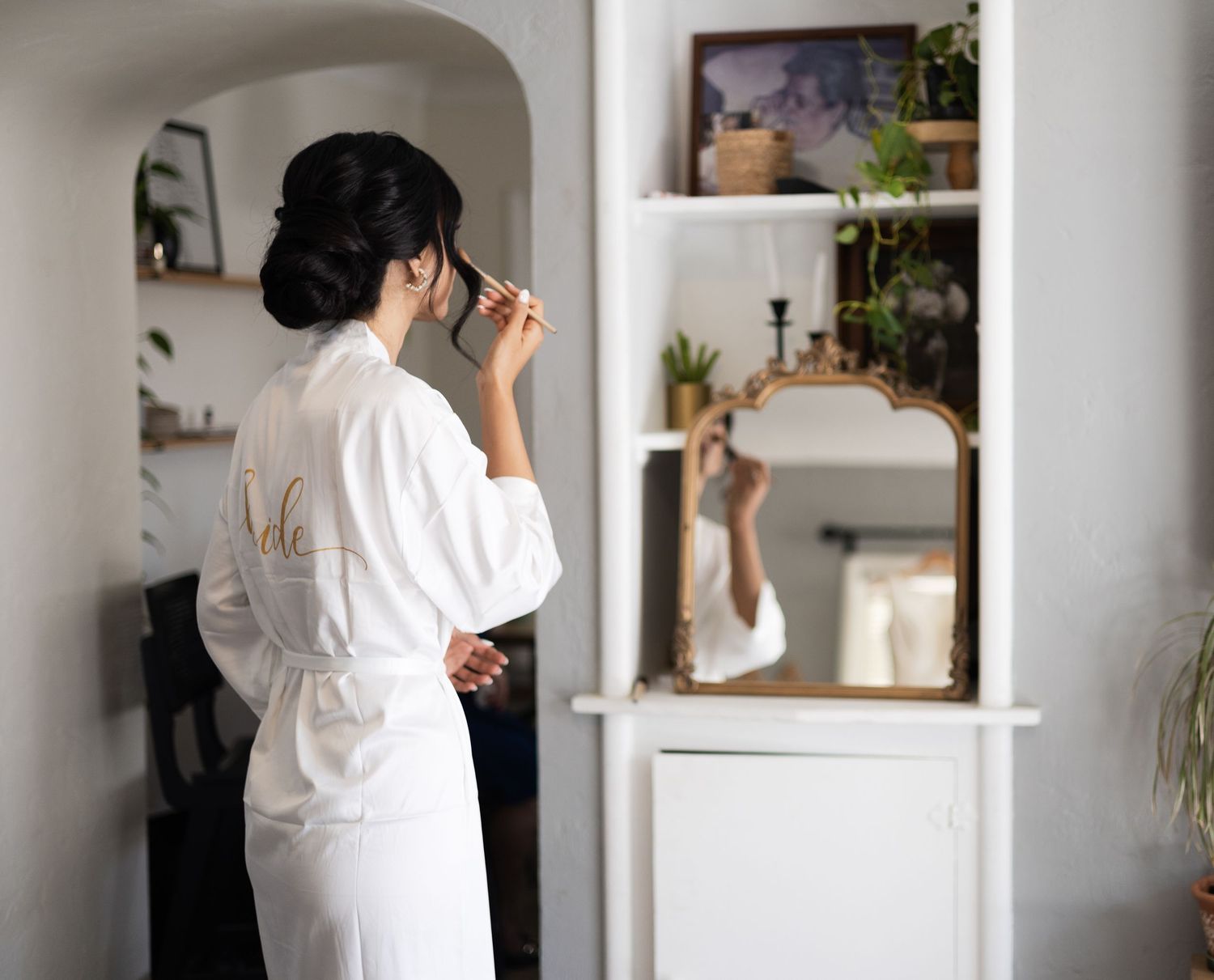 Interior view of modern room with white walls and decorative shelving.
