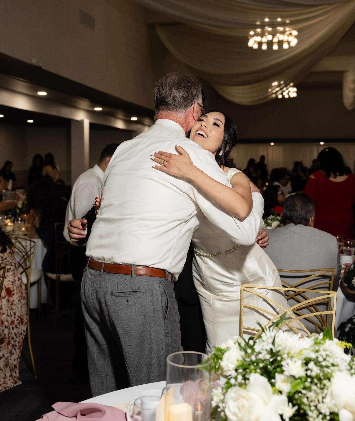 Emotional dance moments between wedding guests at an elegant reception venue.