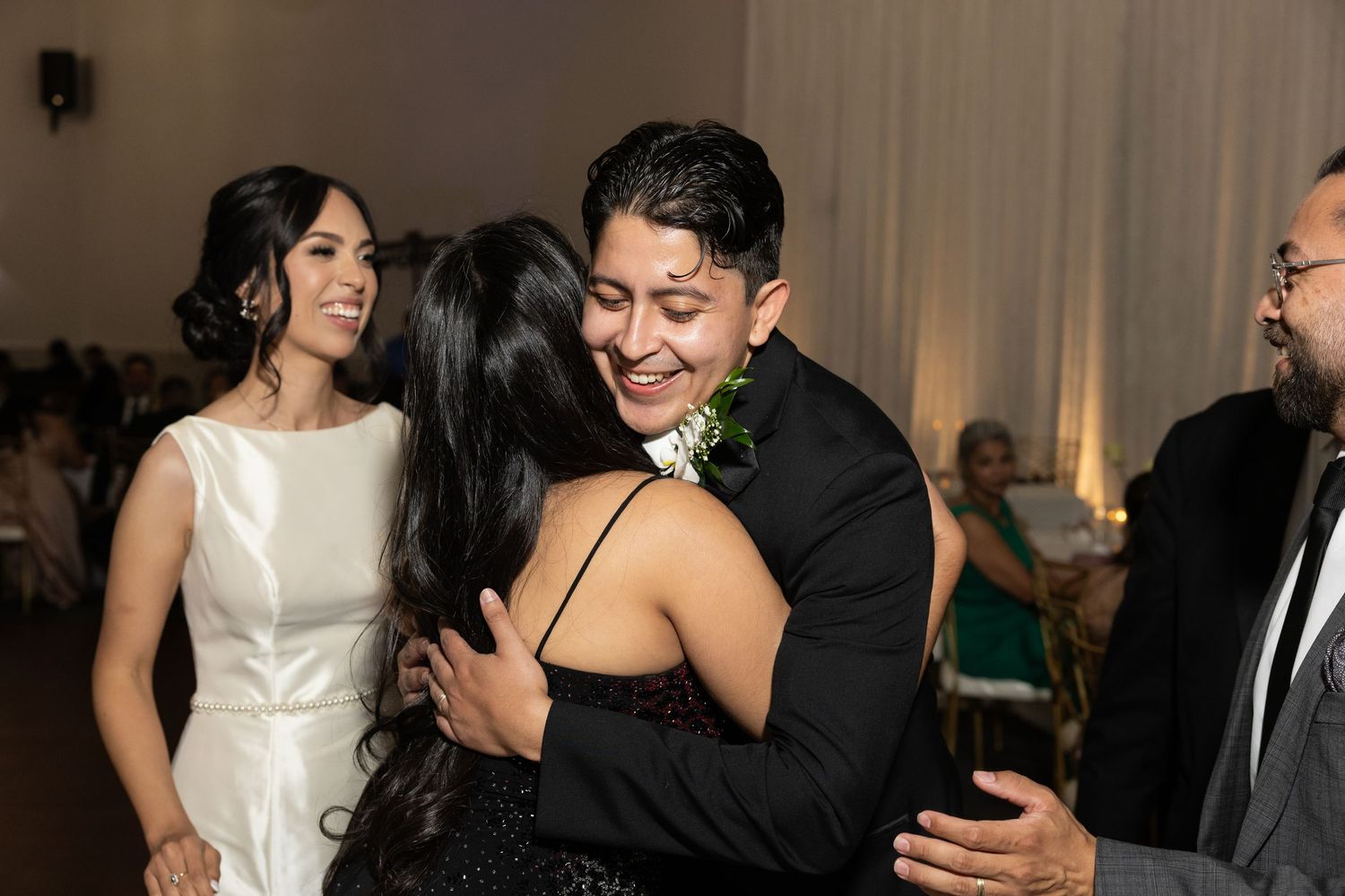 Couple sharing an intimate dance moment at an elegant wedding reception.
