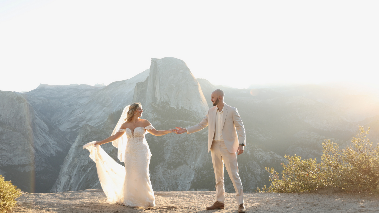 Romantic mountain top wedding portraits with sweeping valley views at sunset.
