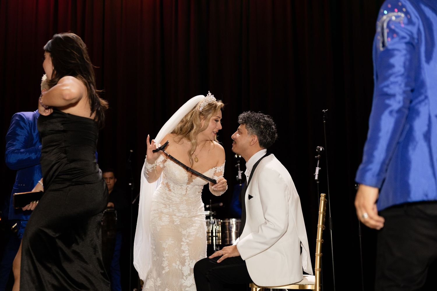 A tender moment between newlyweds during their wedding reception dance.