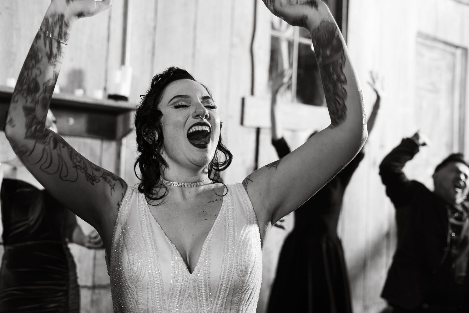 Energetic dance moves captured during wedding reception festivities.