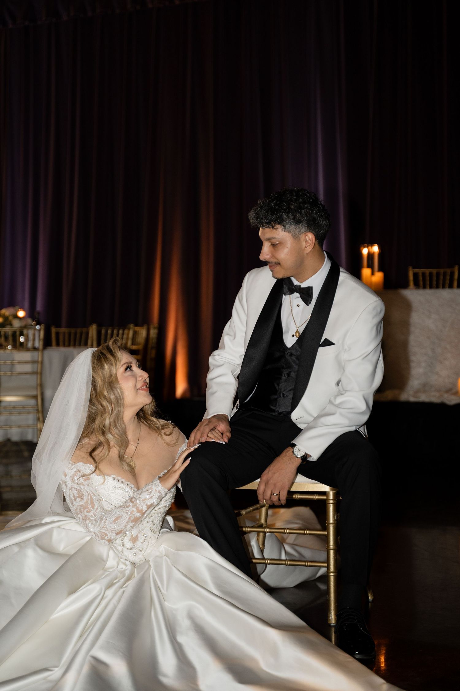 A romantic scene of a couple sharing a moment during their wedding reception.