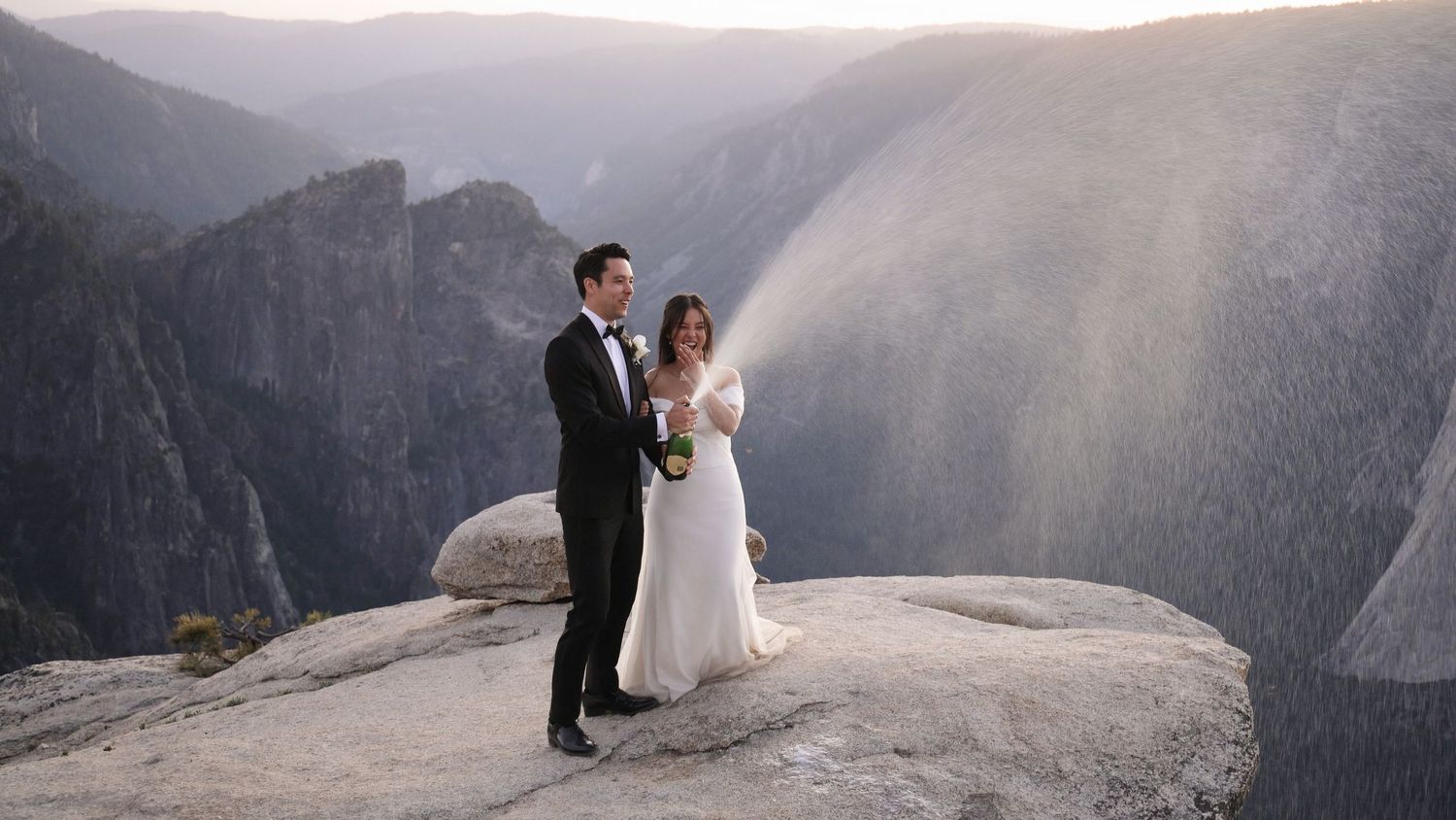 Wedding photography session at Taft Point overlook with dramatic mountain backdrop.