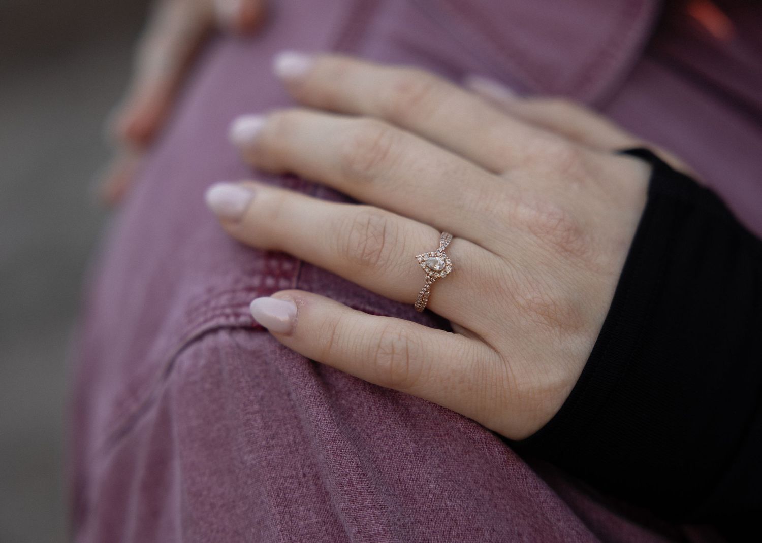 Close-up shot of an engagement ring sparkling in natural light.