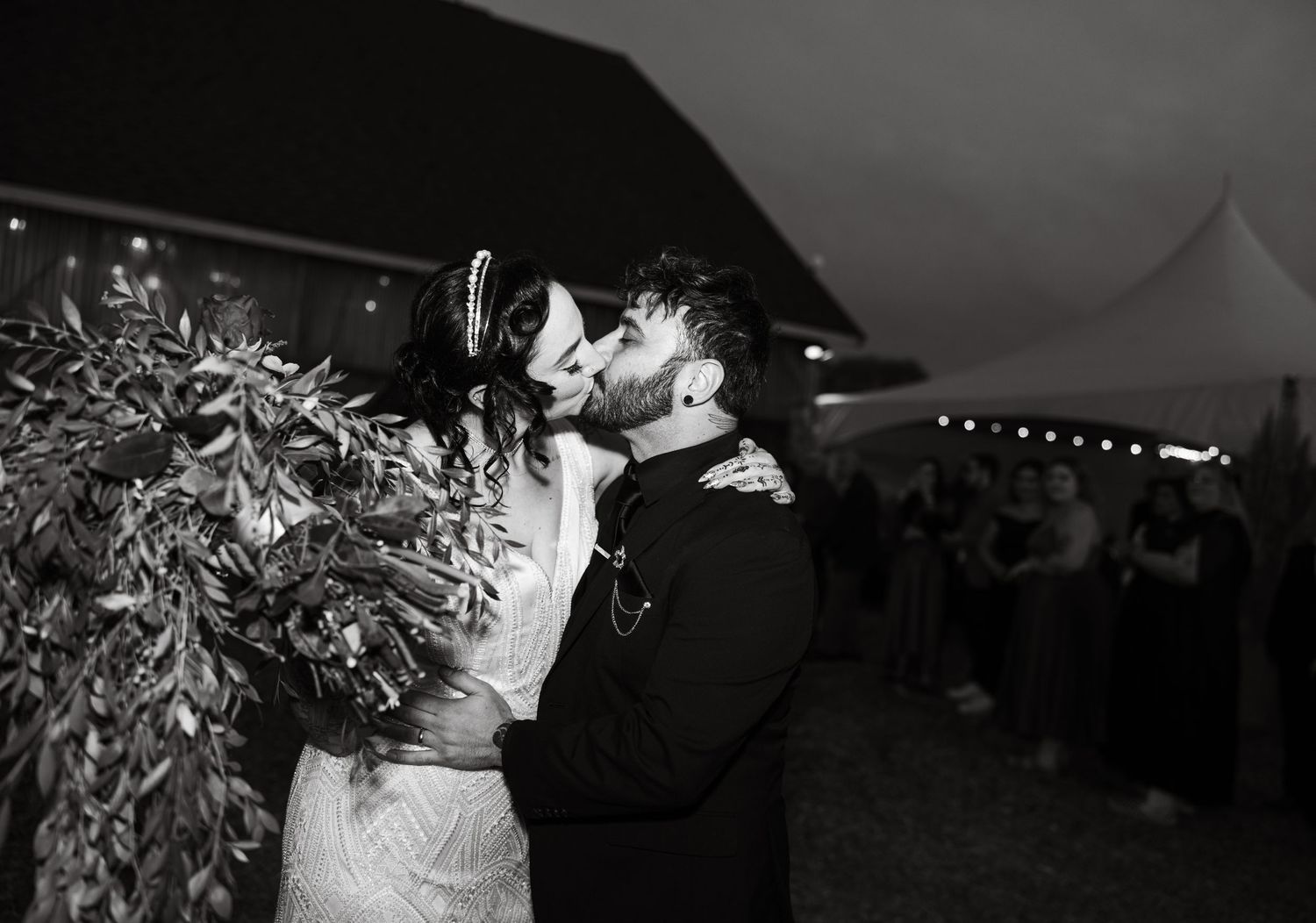 Wedding reception dance floor with silhouettes and dramatic lighting.