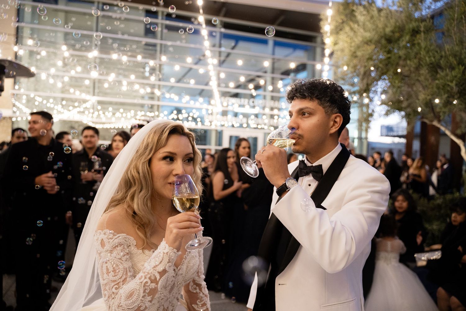 Bride and groom share playful moments during their wedding reception dance.