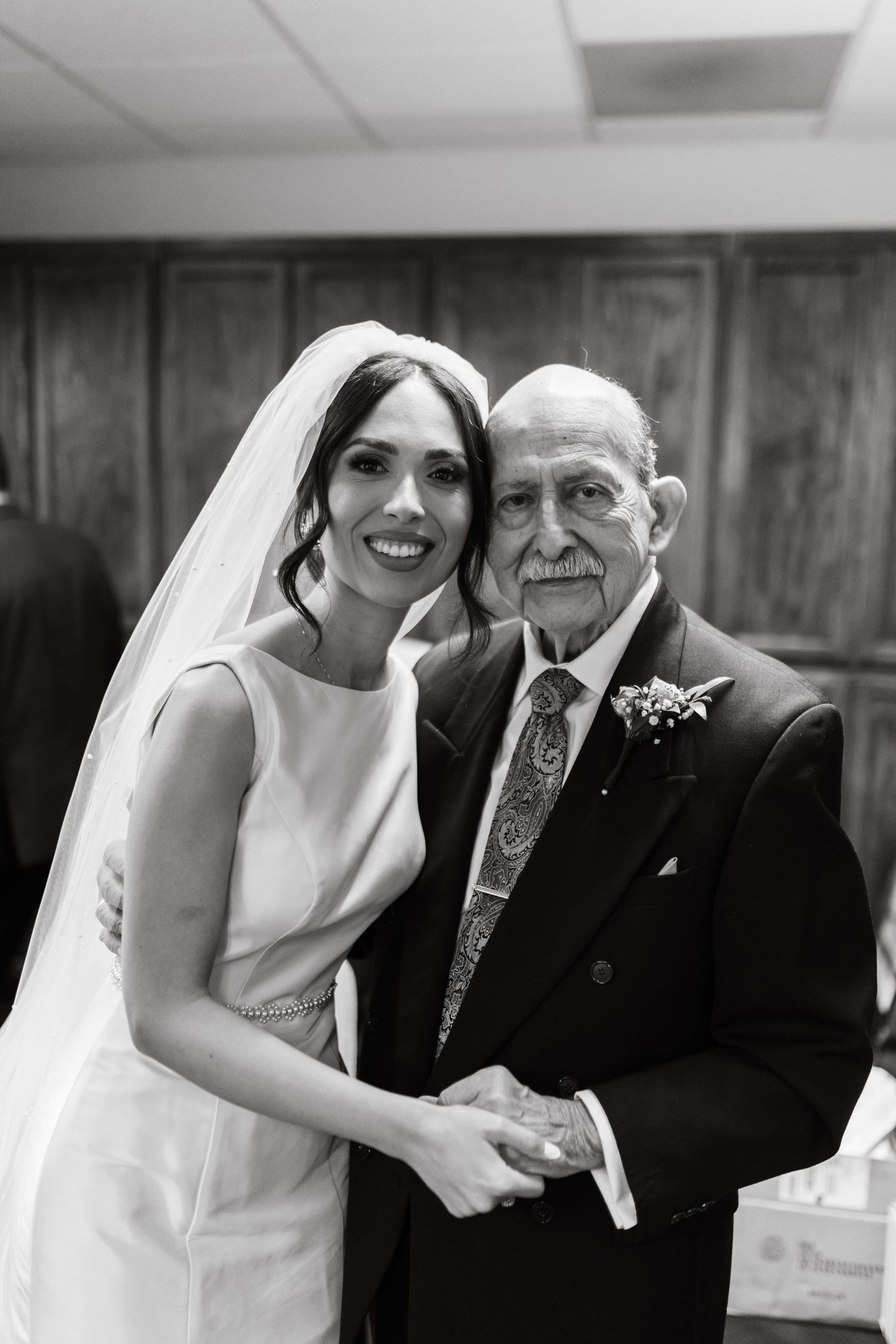Emotional wedding moments captured in black and white as the bride shares special moments.