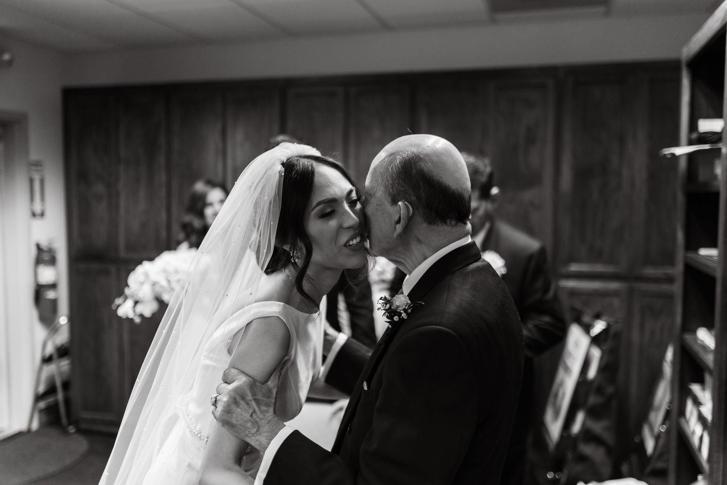 Romantic black and white wedding photography sequence showing tender moments during the ceremony.