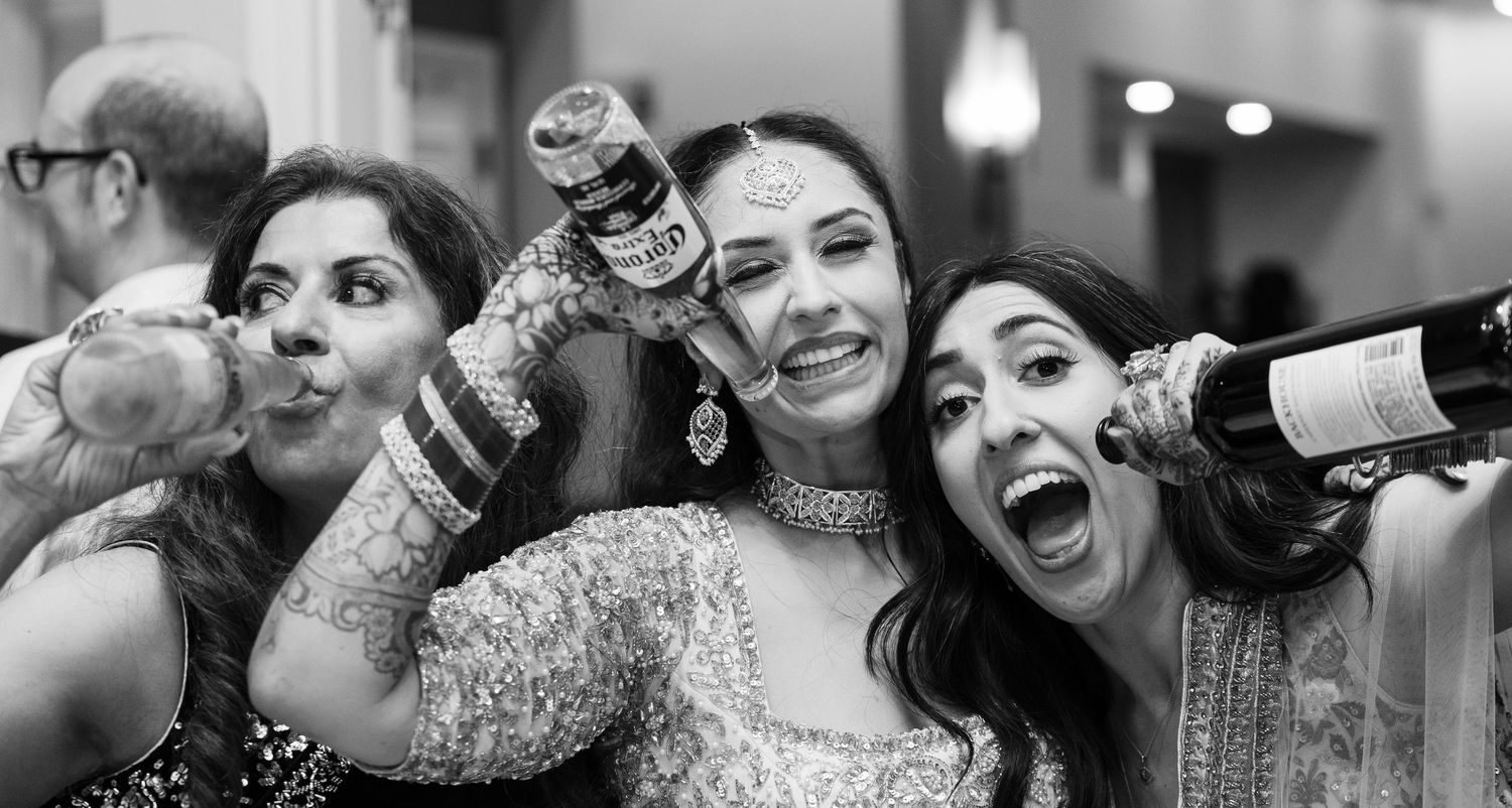 A black and white photo collage showing joyful moments and celebrations at a wedding reception.