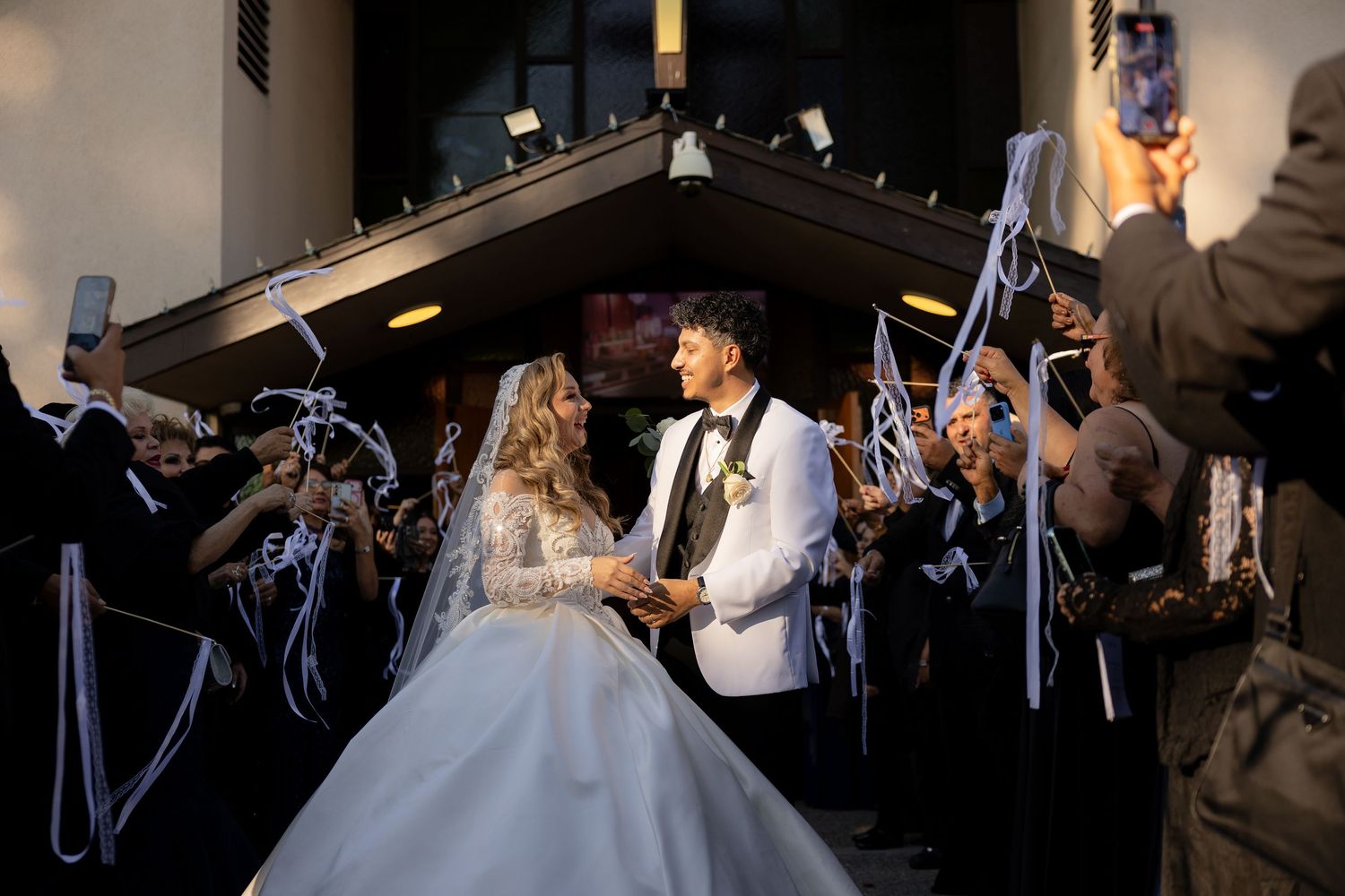 Indoor sparkler exit creates a magical atmosphere as guests line the walkway.