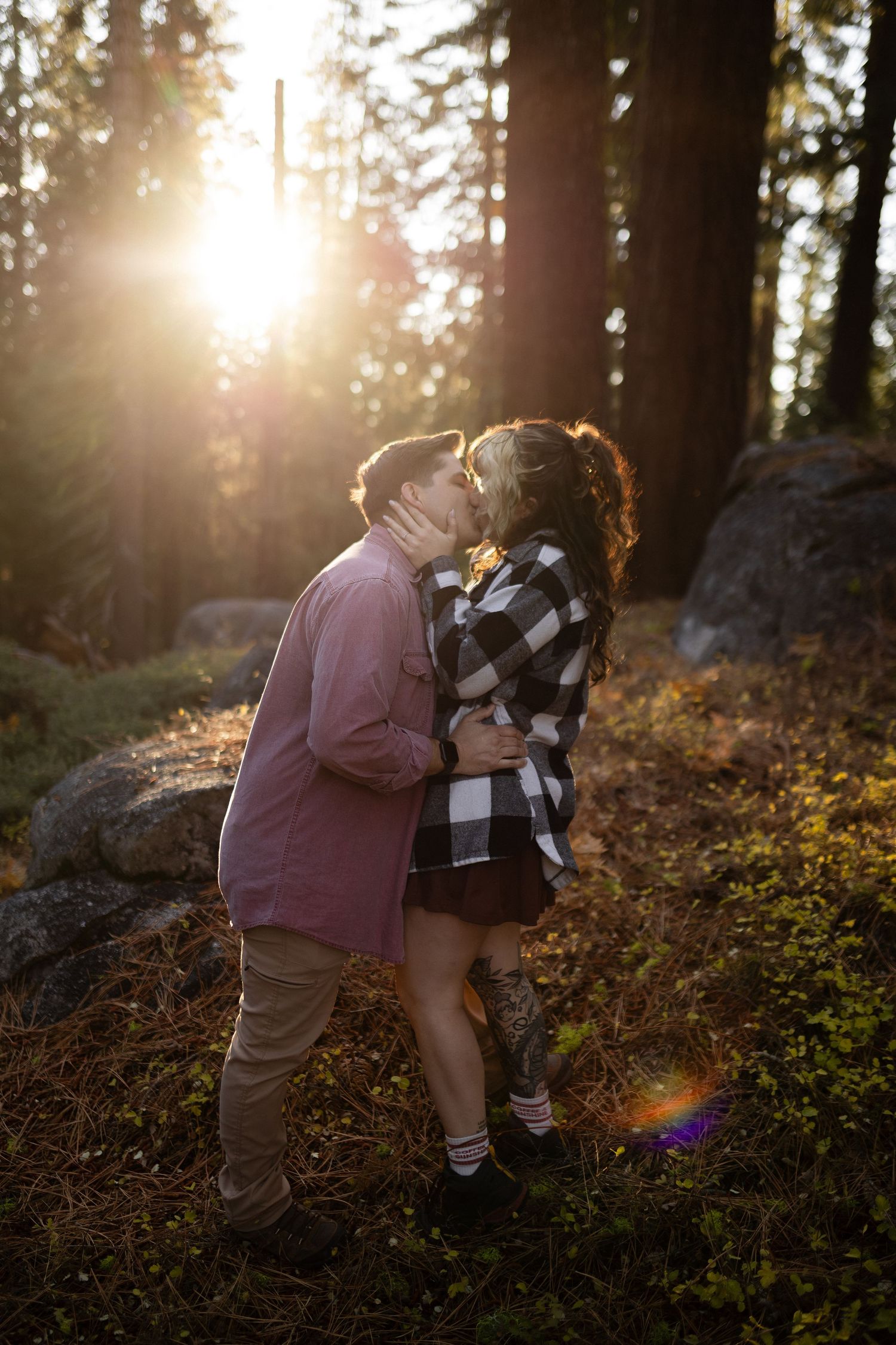 Romantic sunset moment captured in a forest clearing with golden hour lighting.