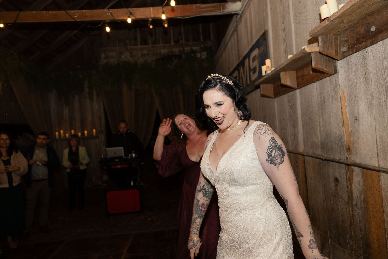 Elegant barn wedding reception with string lights creating a warm atmosphere for dancing.