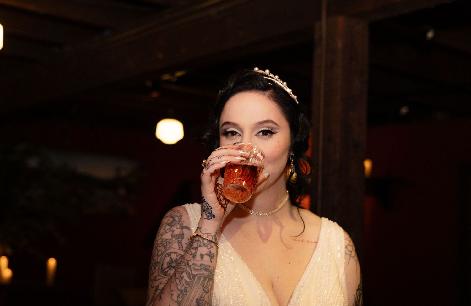 Wedding celebration captured in candid black and white photography at indoor venue.