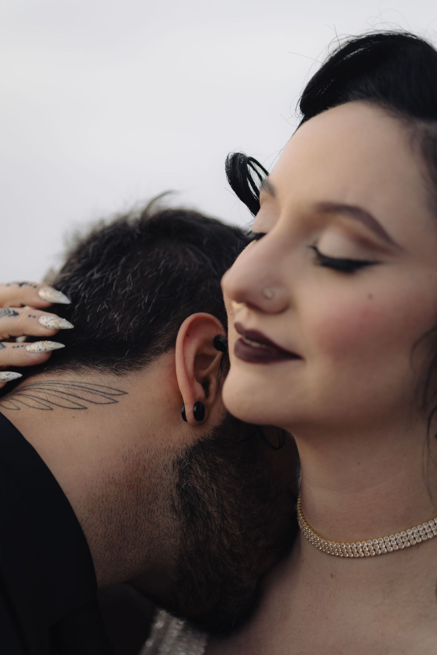 Romantic close-up portrait with delicate jewelry and intimate expressions.