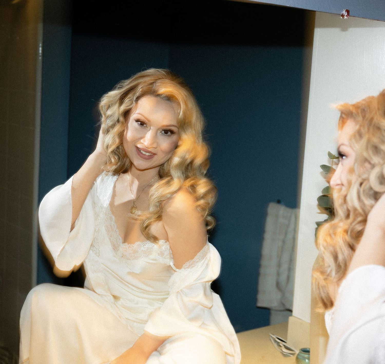Series of lifestyle shots showing people in white clothing posing in a bathroom.
