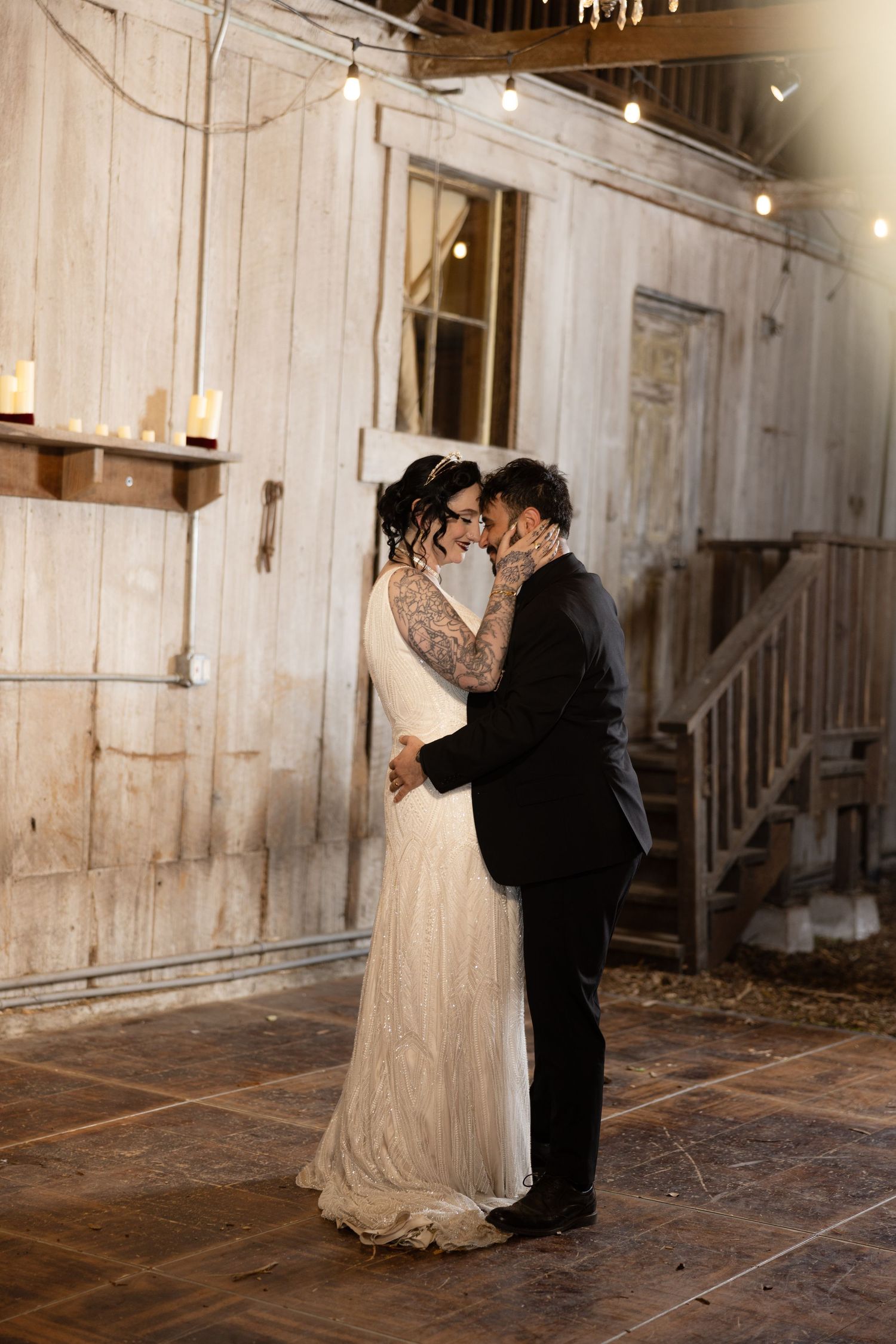Romantic dance poses captured in sequence against rustic barn walls and string lights.