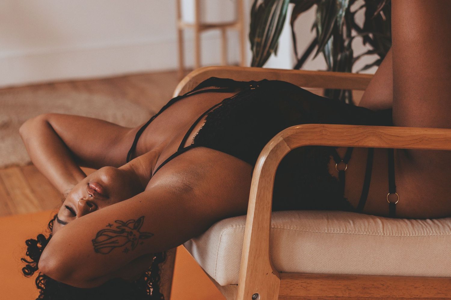 Warm-toned intimate photography session with soft natural lighting and delicate poses.