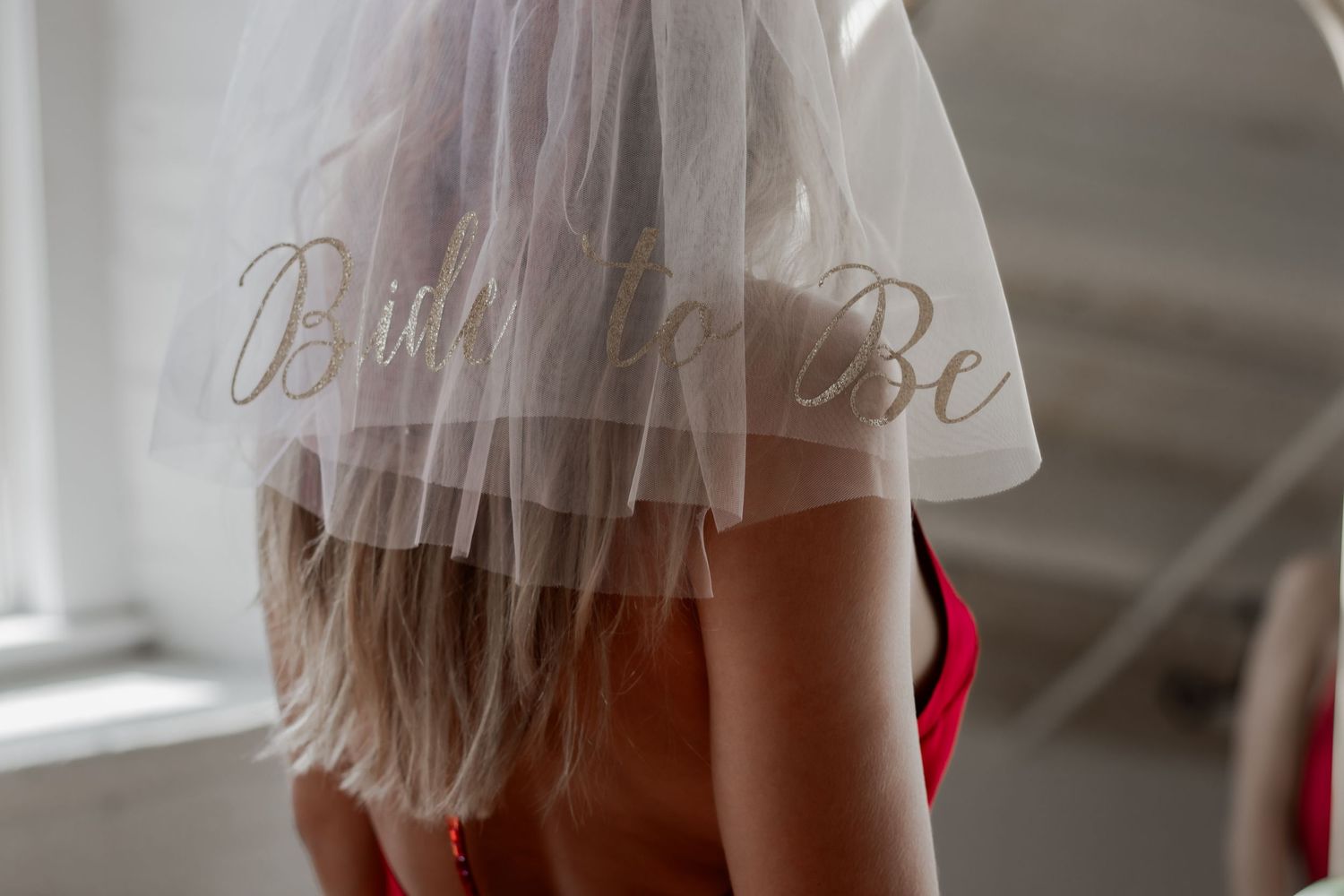 A close-up shot of delicate white lace details on a bridal dress.