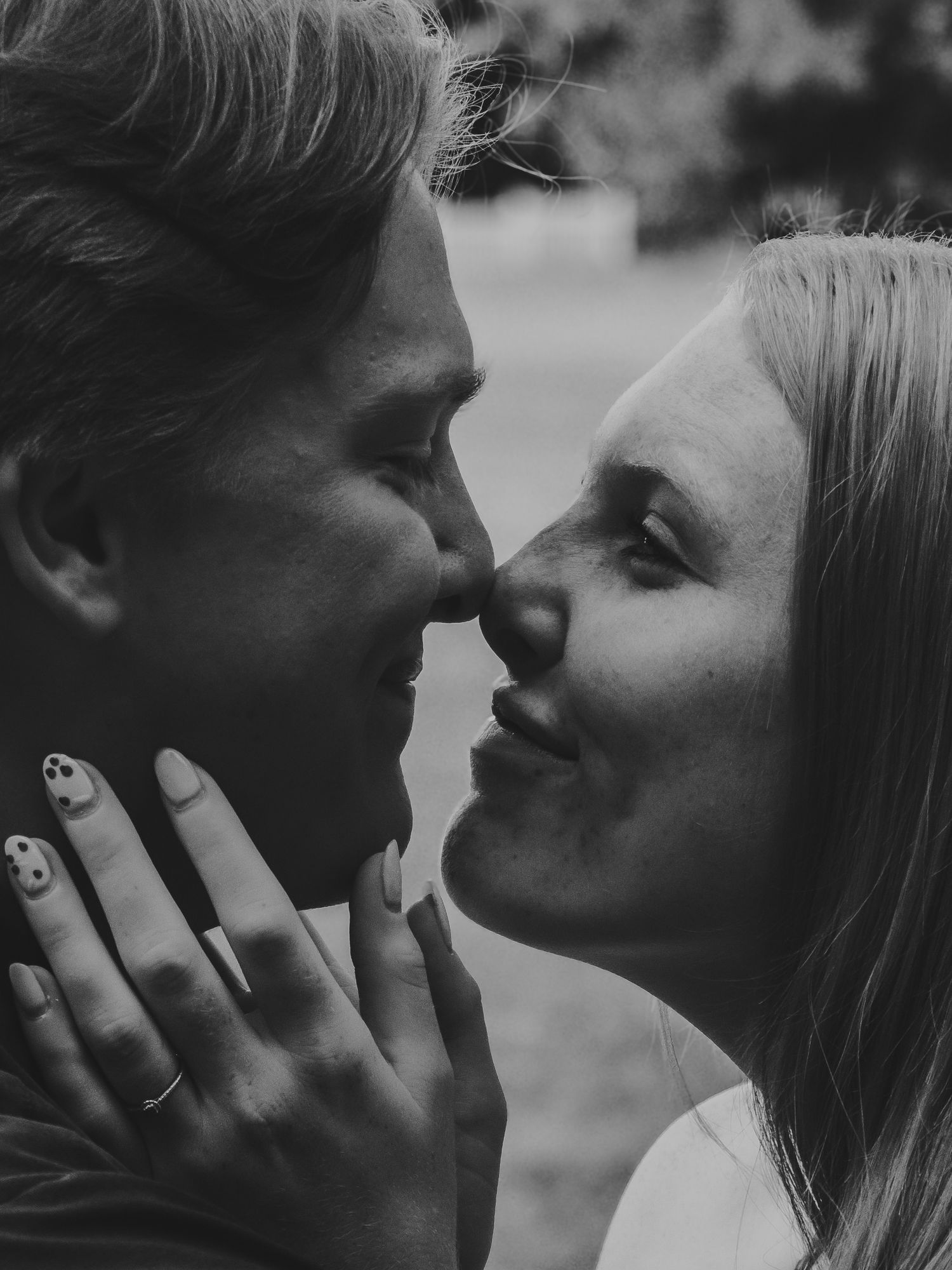 Intimate black and white close-up portrait of a romantic couple.
