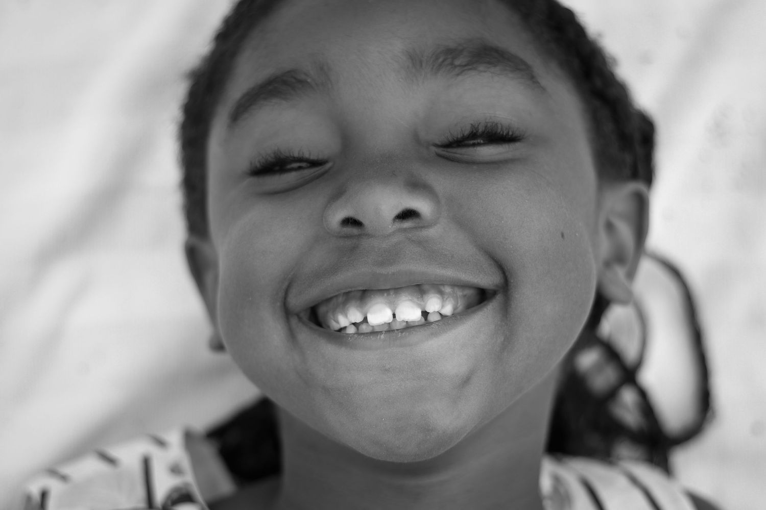 Series of expressive close-up shots showing joyful smiles and laughter.