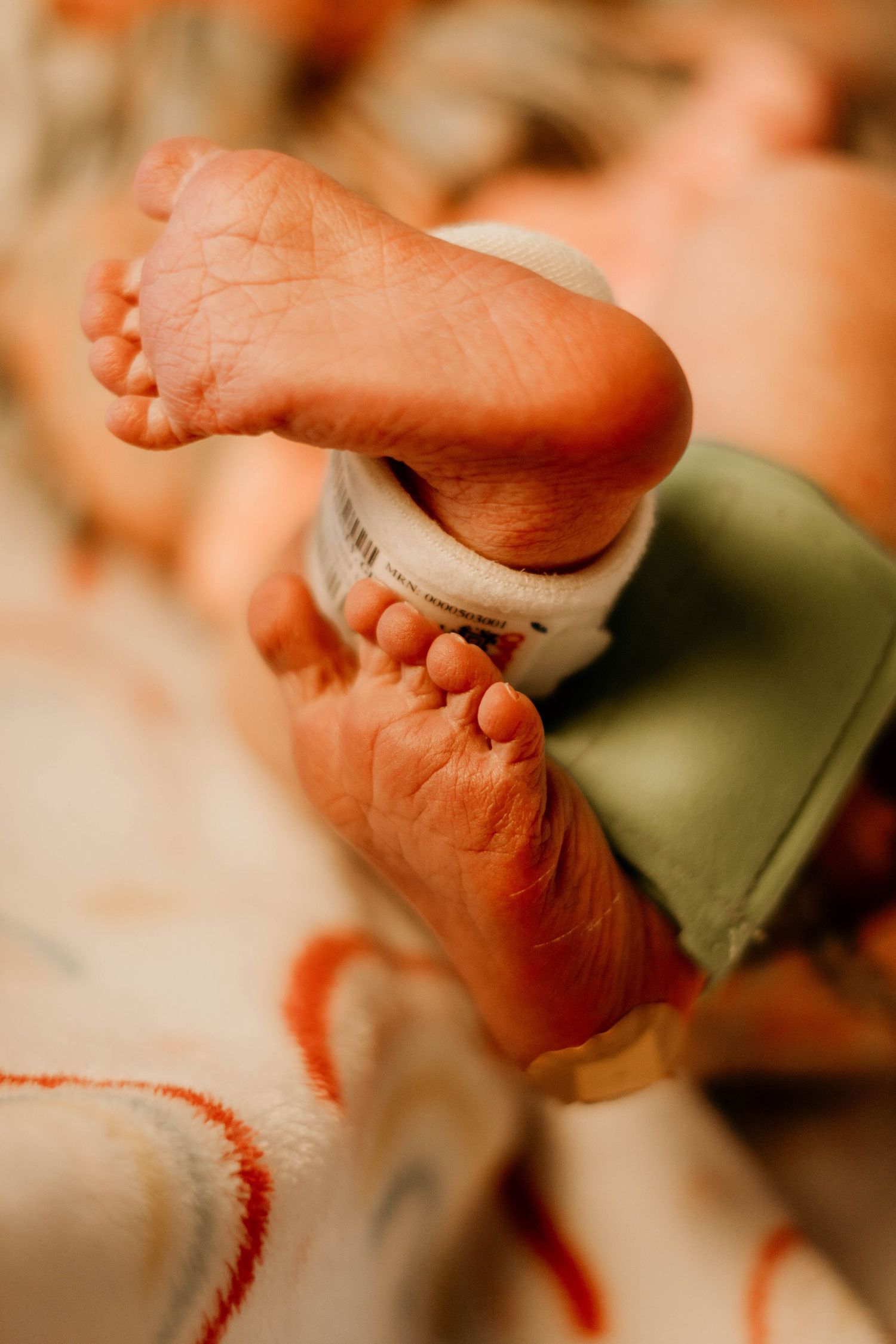 Close-up of a newborn baby's tiny feet - because little moments and details matter.