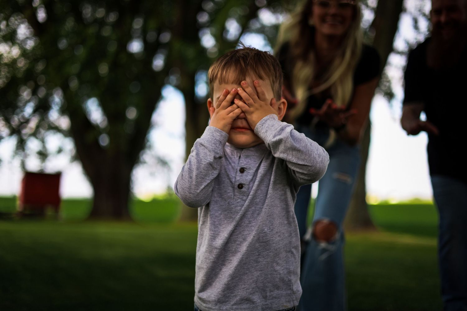 Little boy playing hide n seek